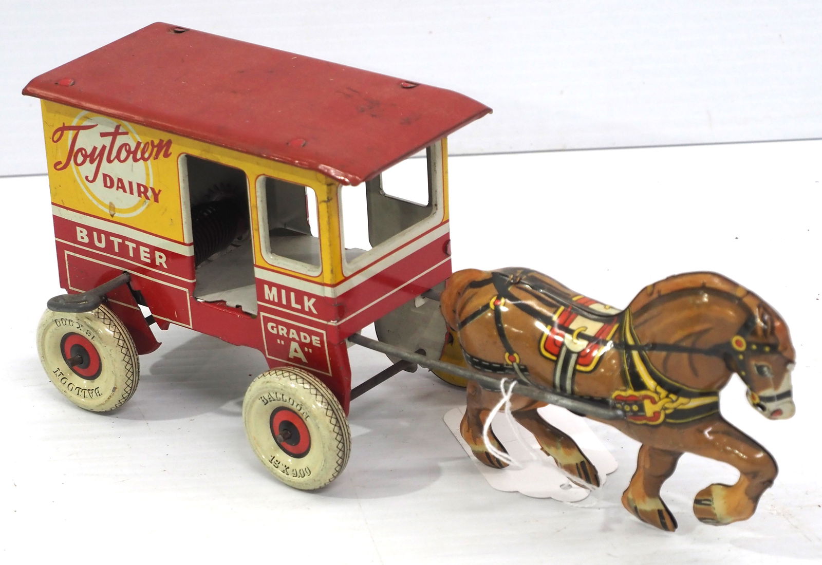 Toytown Dairy horse-drawn milk delivery wagon: Toytown Dairy tin litho horse-drawn milk delivery wagon by Marx, 11"L - Good, winds but weak spring