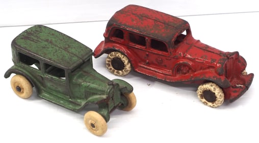 (2) Cast iron sedan cars