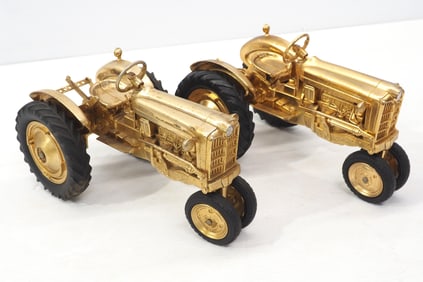 (2) Ford tractors in gold