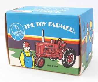 Ertl Farmall Super M-TA Toy Farmer