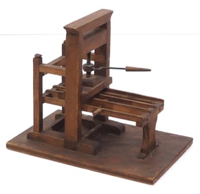Wooden model of early printing press