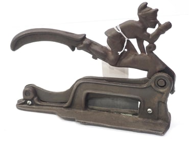 Cast iron figural tobacco chopper by Brighton
