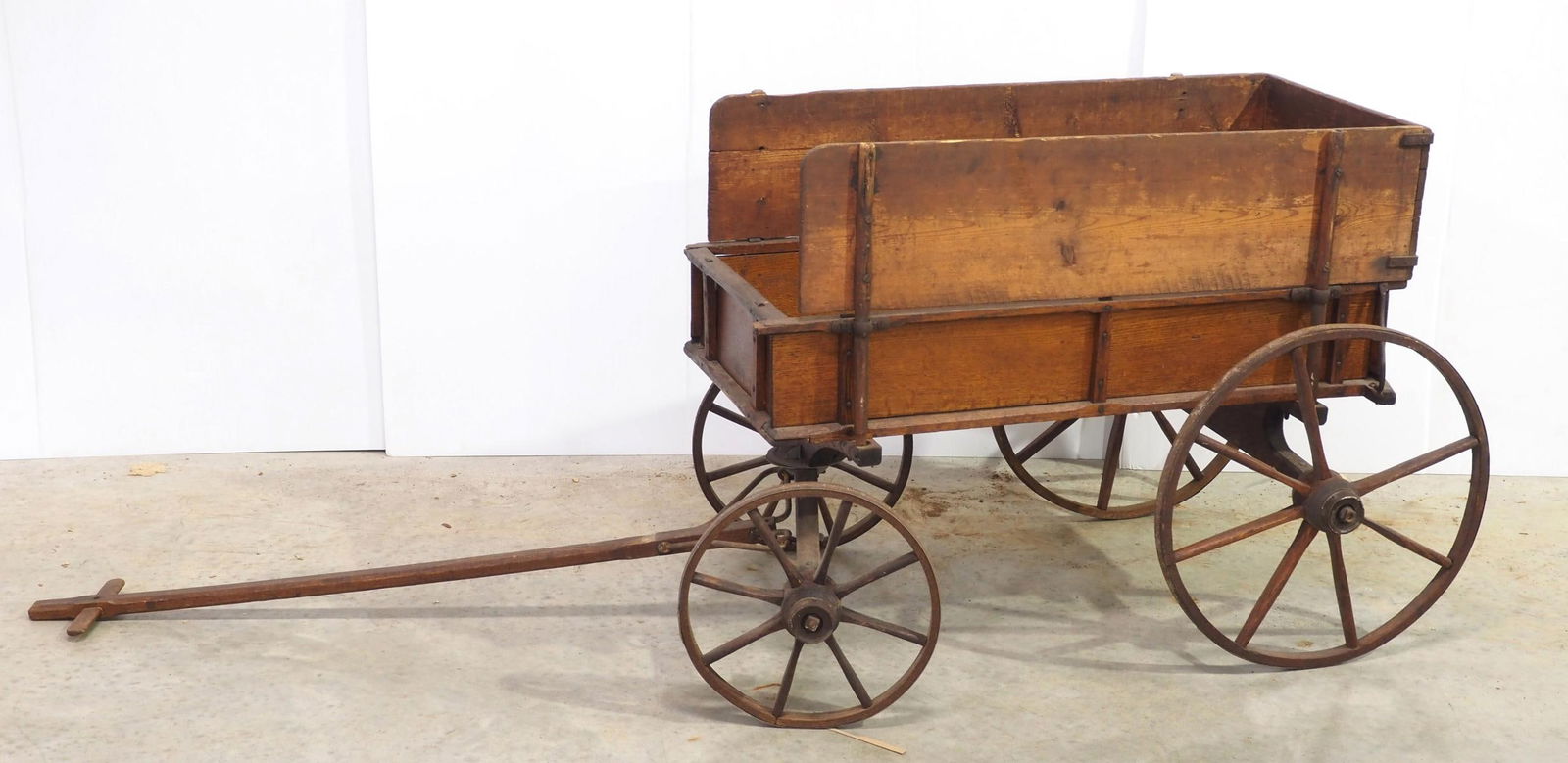Early wooden goat wagon: Early wooden goat wagon with extra side board and pull handle * * White Glove Delivery available, please contact the auction house for details and a quote.
