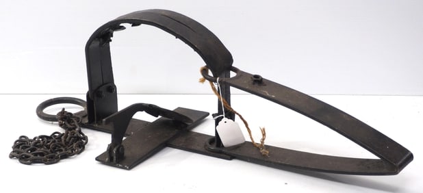 Hand-forged iron bear trap with chain