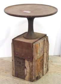 Cast iron anvil table mounted on wood block