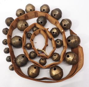 Leather strap of graduated brass harness bells
