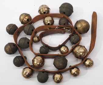 Leather strap of graduated brass harness bells