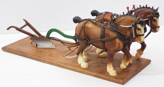 Homemade walking plow hitched to large team