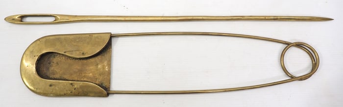 Store display brass safety pin and sewing needle