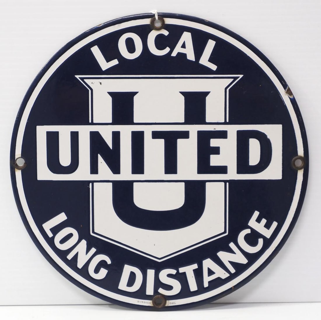 United Local Long Distance sign: 10.25"dia. SSP United Local Long Distance sign marked Burdick * * White Glove Delivery available, please contact the auction house for details and a quote.
