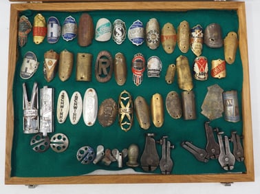 Case of assorted bicycle badges