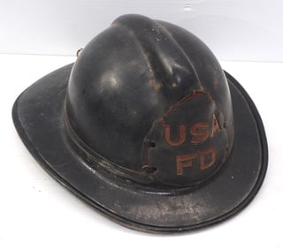 Fireman helmet with leather badge
