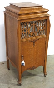 Symphonola hand-crank record player in cabinet