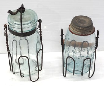 (2) Small glass canning jars with wire carriers