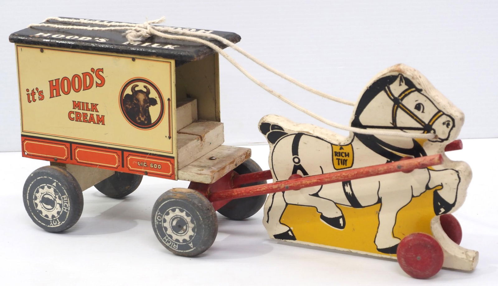 Hood's Milk & Cream delivery wagon pull toy: Hood's Milk & Cream dairy delivery wagon pull toy by Rich Toys, wooden horse & wagon with tin sides and roof, 18"L - Good with play wear