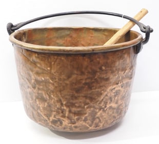 Copper kettle with handle and wood stirrer