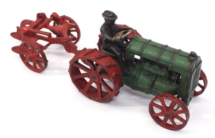 Arcade cast iron tractor and 1-bottom plow