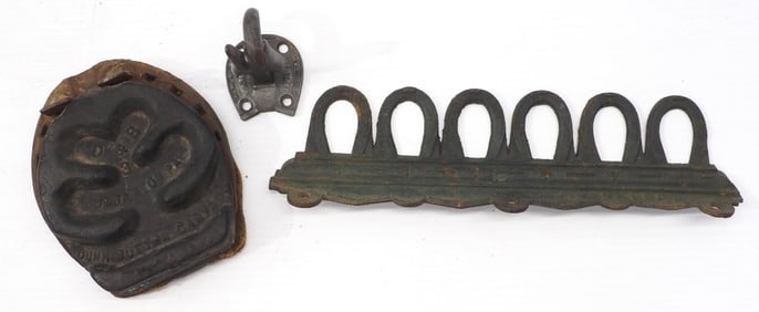 Whip holder / Horseshoe item / broom holder?