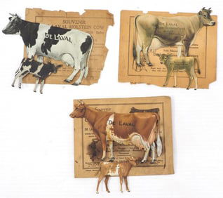 (3) DeLaval tin cow & calf sets with envelopes