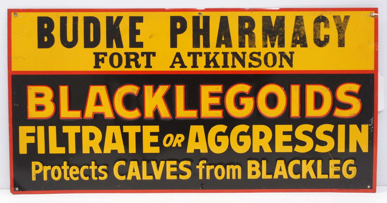 Blacklegoids sign: 23.5"x12" SST embossed Blacklegoids sign for Budke Pharmacy, Fort Atkinson, marked American Art Works - Good with some scratches