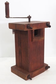 Hand-crank grinder with decorative nuts on bolts