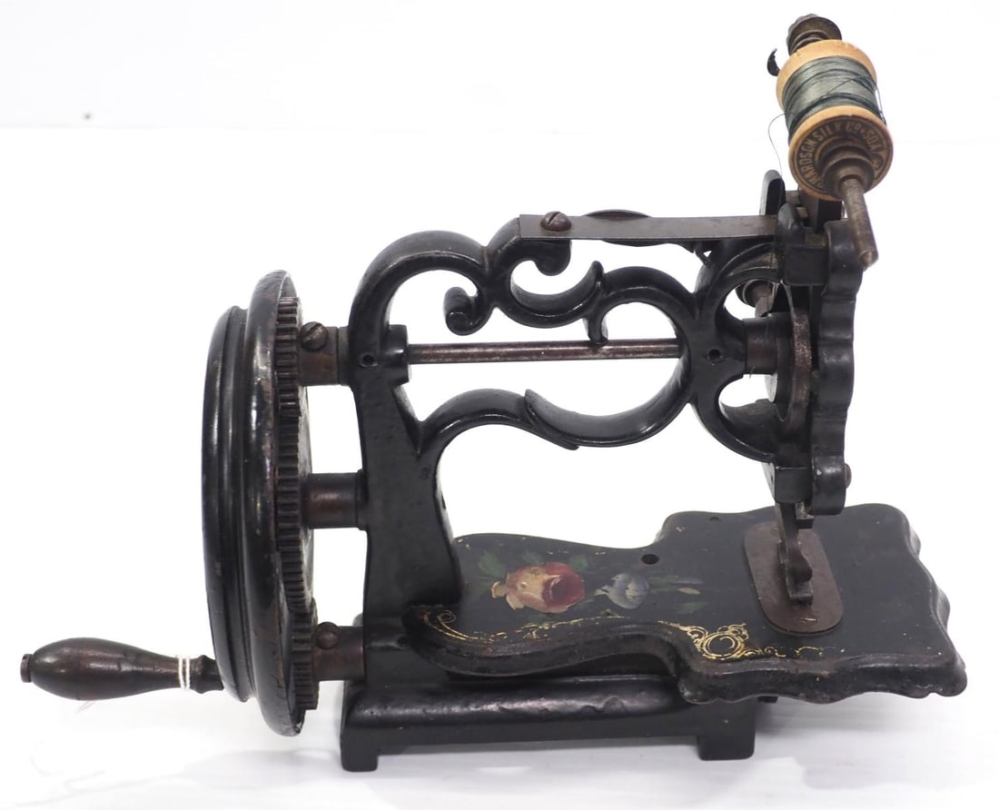 Early hand-crank sewing machine (1 of 3)
