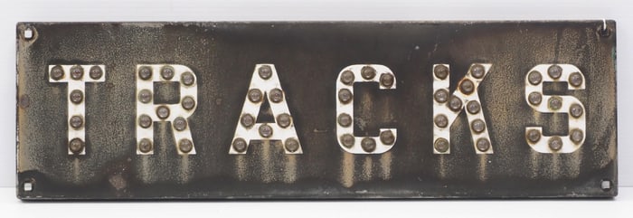 TRACKS sign with reflective cat-eyes