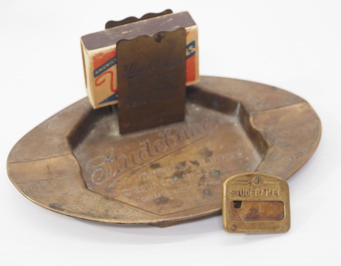 Studebaker Wagons brass ash tray: Studebaker Wagons brass ash tray with matchbox holder and Studebaker ID badge pinback