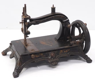 Early hand-crank cast iron sewing machine