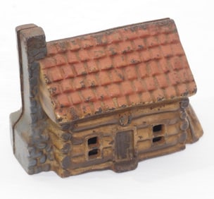 Cast iron log cabin-shaped bank