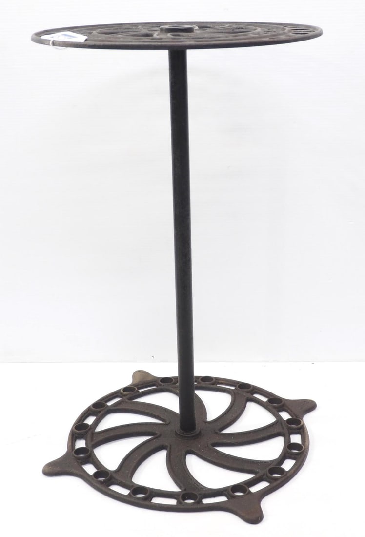 S.C. Tatum & Co. country store broom holder: S.C. Tatum & Co. cast iron country store broom holder, 16"dia x 26.5"H