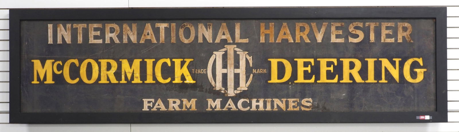 IH-McCormick Deering Farm Machines sign: 10'3"x32" (with frame) tin & sandstone International Harvester-McCormick Deering Farm Machines sign in wood frame, WOW! - Good * * Item(s) not eligible for shipping, contact Chupp Auctions for driver