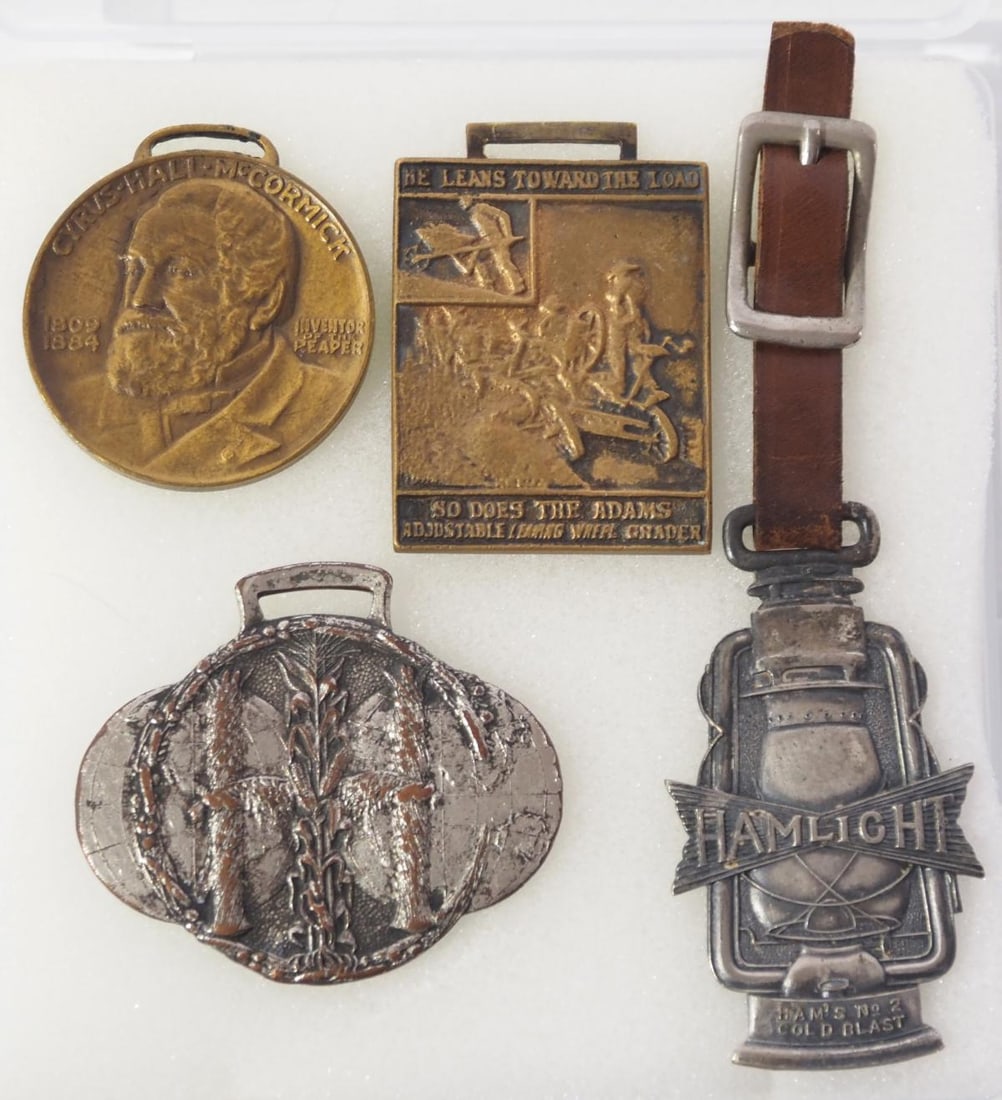 (4) Advertising watch fobs: (4) Advertising watch fobs: Hamlight lanterns / Cyrus Hall McCormick (invented reaper) / Adams Adjustable Leaning Wheel Grader / International Harvester