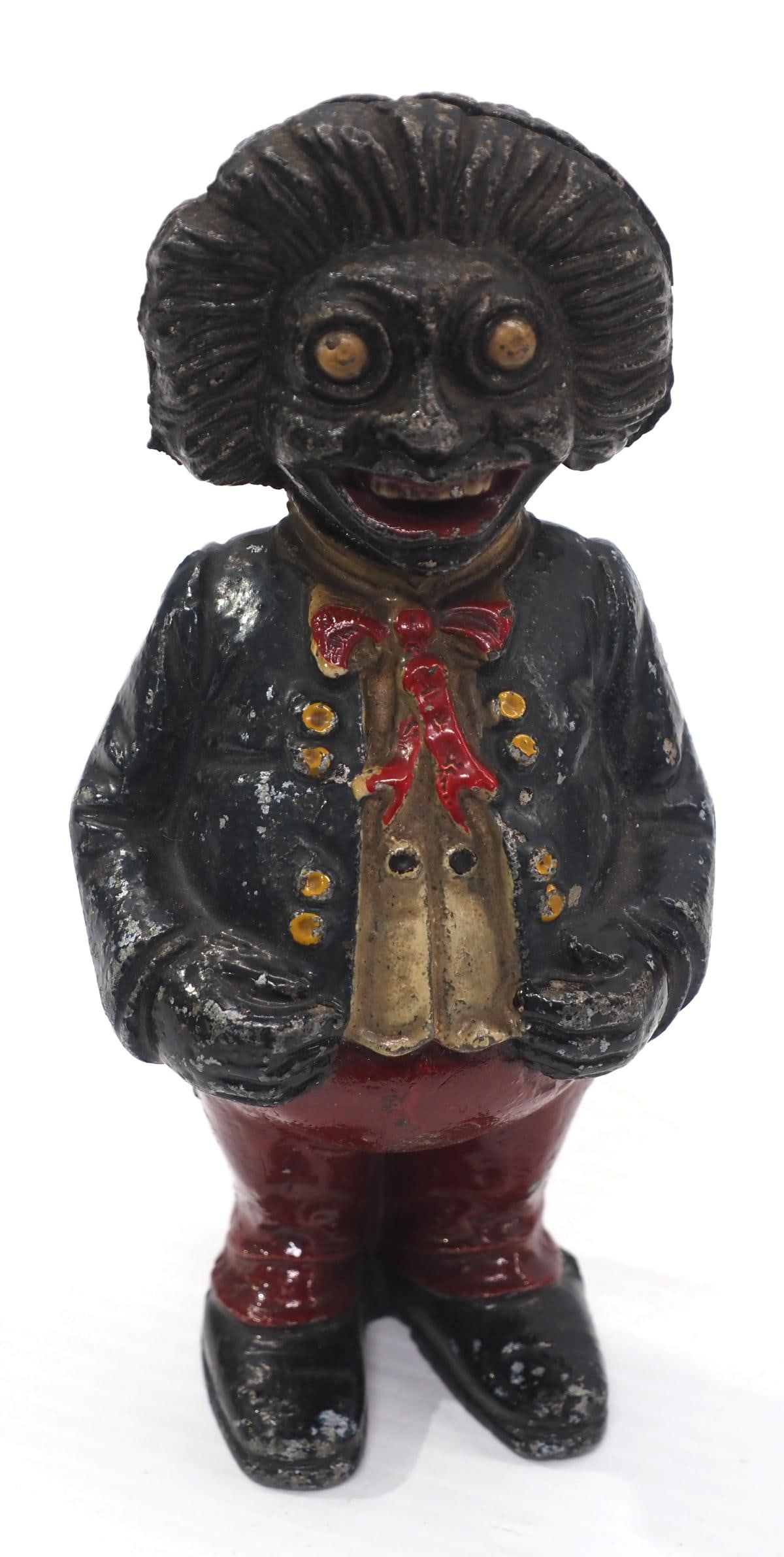 Golliwog coin bank made of spelter: Golliwog coin bank made of spelter with some original paint, 6"H - Good