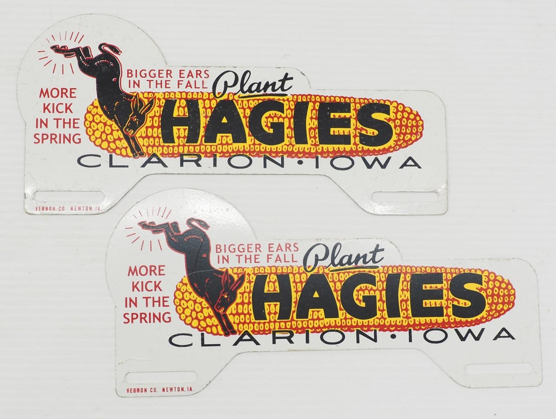 (2) Plant Hagies SST license plate toppers: (2) Plant Hagies SST license plate toppers, marked Vernon Co.