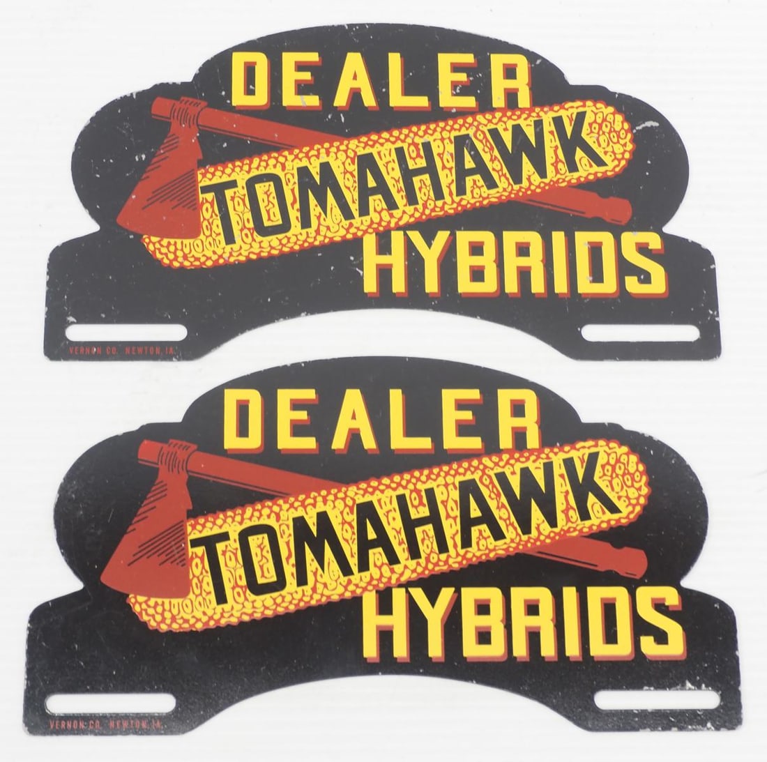 (2) Tomahawk Hybrid Dealer license plate toppers: (2) Tomahawk Hybrid Dealer SST license plate toppers, marked Vernon Co.