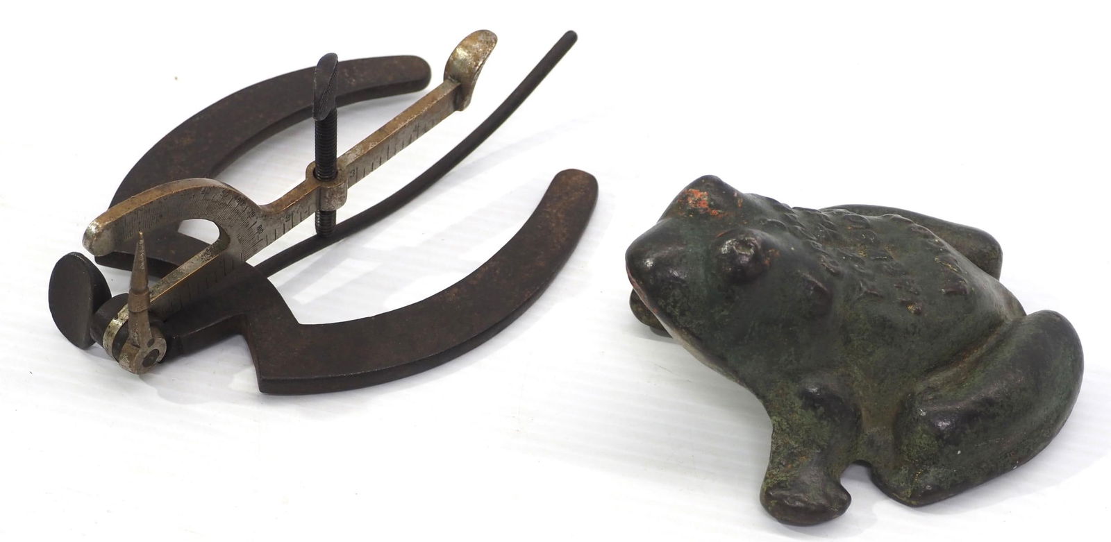 Early hoof measure and advertising frog: Early hoof measure marked John Hood Co. Boston / cast iron advertising frog for Jackson Wagon
