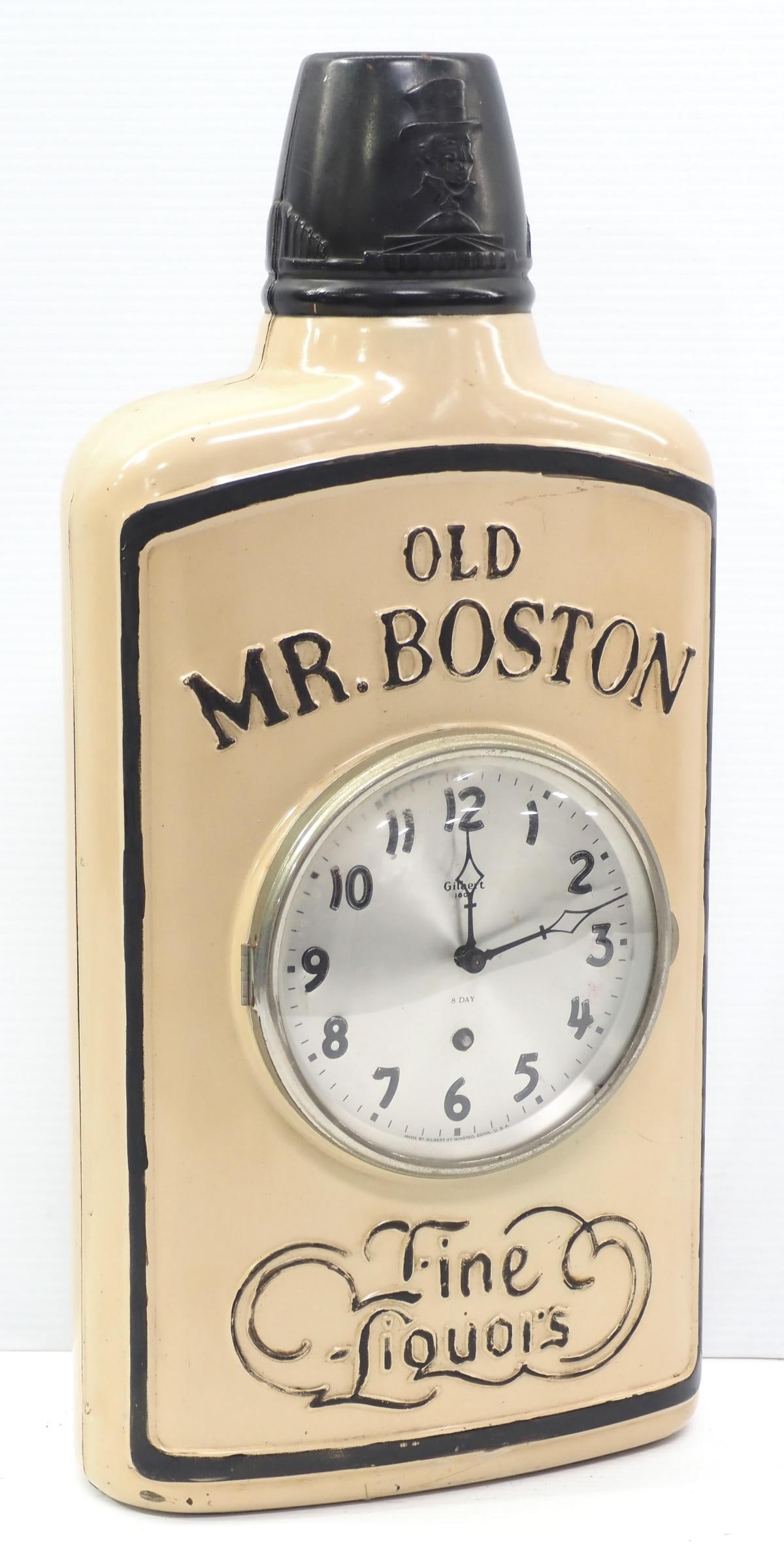 Large store display metal bottle: Large store display metal bottle for Old Mr. Boston Fine Liquors with key-wind clock insert, 10"x5"x21.5"H * * This lot will be delivered to the UPS Store for professional packing and shipping. Call 5