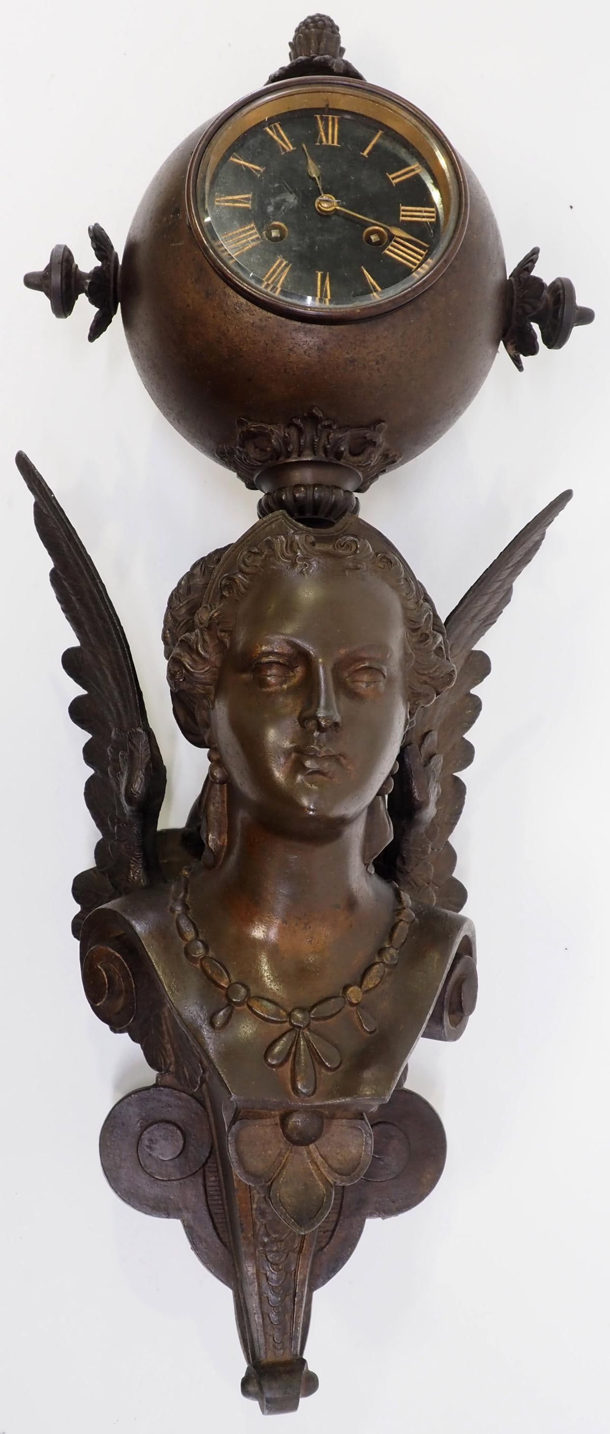 Winged Maiden Wall Clock: Beautiful Life-Like Spelter and Cast, Dual Winding, Winged Maiden Wall Clock with Pendulum - Wing has repair Condition NOTICE! VERY IMPORTANT! Chupp Auctions is pleased to issue an opinion on any lot;