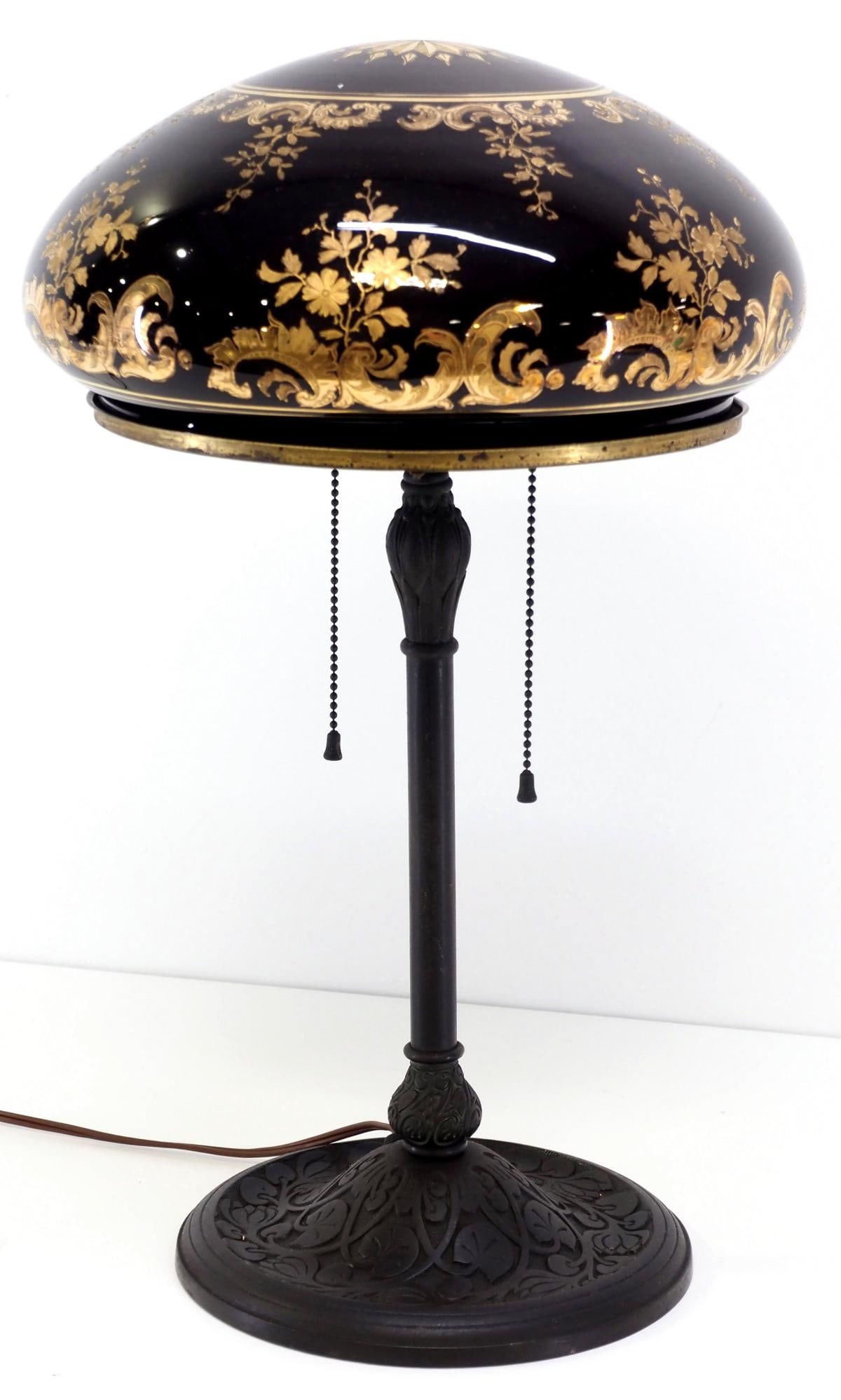 Period Table Lamp with Red Cased Glass Shade with Gold Floral Overlay: Period Table Lamp with Pigeon Blood Red Cased Glass Mushroom-Shaped Shade with Gold Floral Overlay and Double Socket Base Condition NOTICE! VERY IMPORTANT! Chupp Auctions is pleased to issue an opinio