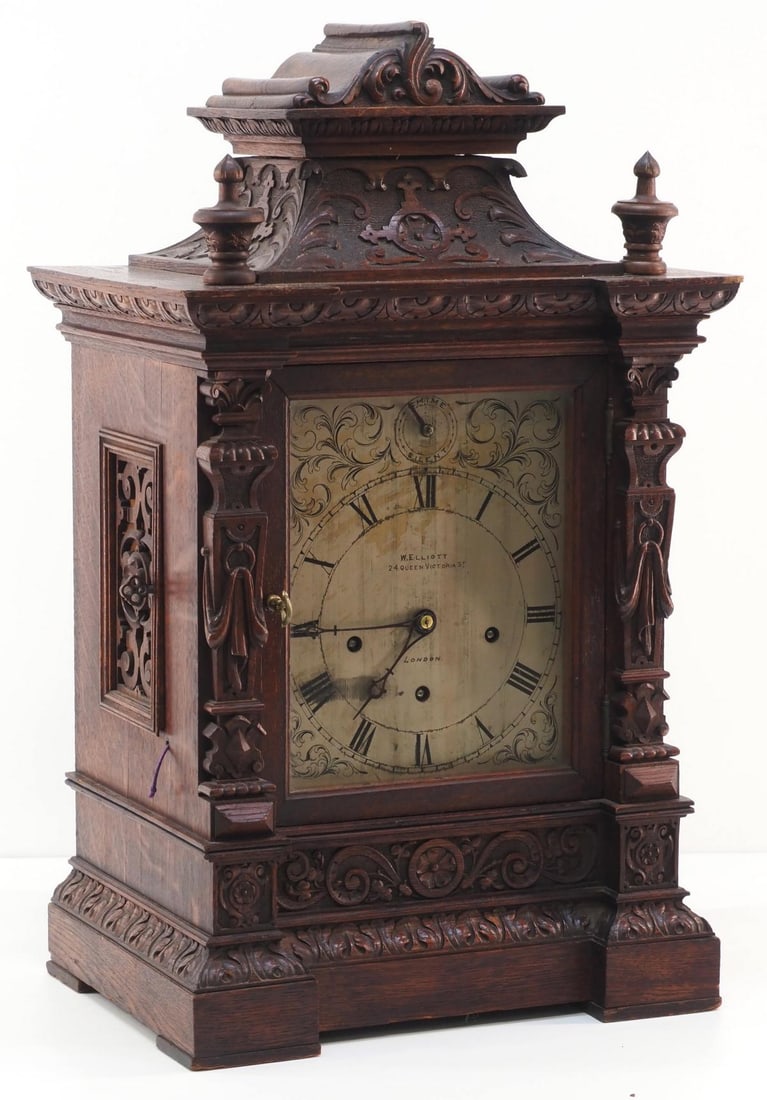 W. Elliott-London Musical Bracket Clock: W. Elliott-London Musical Bracket Clock with 5 Gongs, in Heavily Carved Oak Case with Silvered Dial, works marked Winterhalder-Hofmeier Condition NOTICE! VERY IMPORTANT! Chupp Auctions is pleased to i