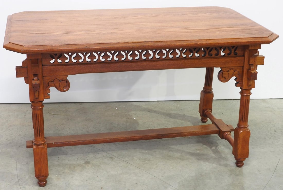 Gothic Carved Chestnut Library Table: Gothic Carved Chestnut Library Table Condition NOTICE! VERY IMPORTANT! Chupp Auctions is pleased to issue an opinion on any lot; the absence of a condition report does not indicate that a lot is in pe