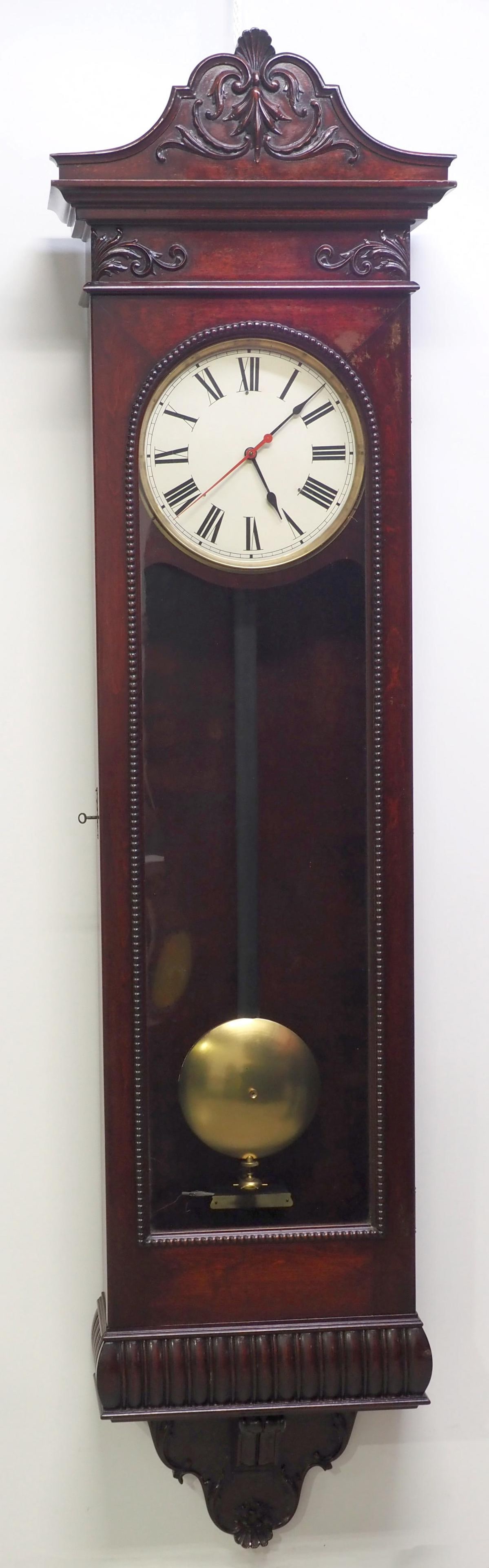 NY Standard Watch Co. Mahogany Regulator Wall Clock: NY Standard Watch Co. Mahogany Regulator Wall Clock with Carved Crest/Base and Large Brass Pendulum Condition NOTICE! VERY IMPORTANT! Chupp Auctions is pleased to issue an opinion on any lot; the abse