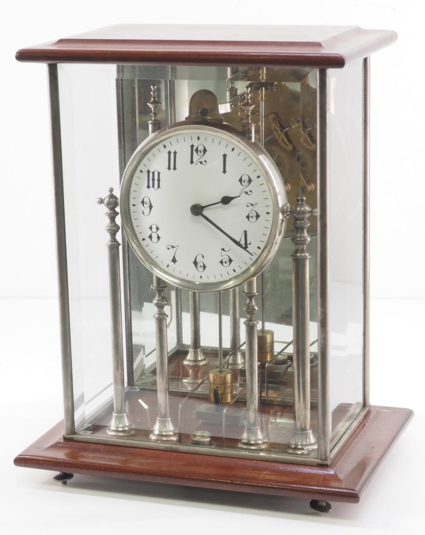 Early 20th Century Electromagnetic Clock: Early 20th Century Electromagnetic Clock with Glass Case and Mirrored Back Condition NOTICE! VERY IMPORTANT! Chupp Auctions is pleased to issue an opinion on any lot; the absence of a condition report