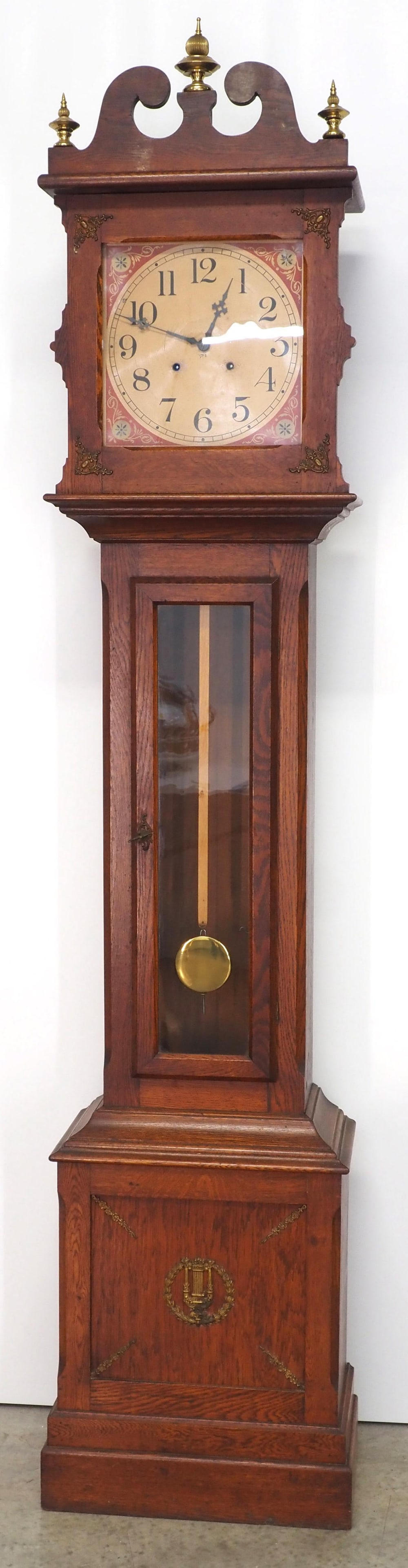 Quartersawn Oak Ithaca Weight-Driven Grandfather Tall Case Clock: Quartersawn Oak Ithaca Weight-Driven Grandfather Tall Case Clock with Paper Dial and Brass Ornamental Embellishments, marked 1753. Condition NOTICE! VERY IMPORTANT! Chupp Auctions is pleased to issue 