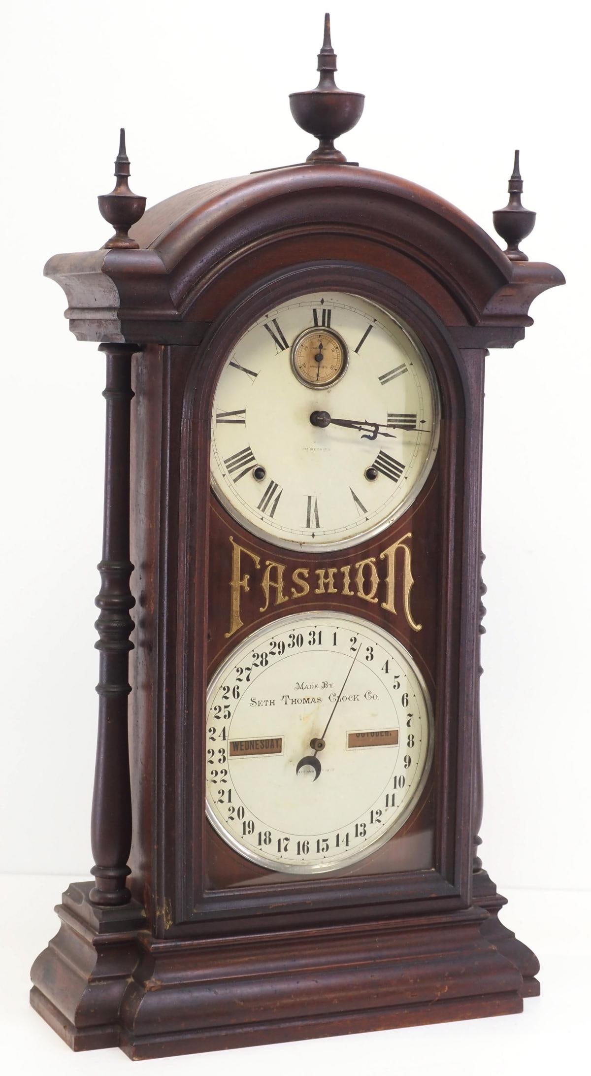 Fashion No.5 19th Century Double Dial Seth Thomas Calendar Clock: Fashion No.5 19th Century Double Dial Seth Thomas Calendar Clock in Walnut Case, Turned Wood Columns and Finials, 8-Day Spring Movement, Reverse Painted Gold Leaf on Glass Door reads "Fashion&quo