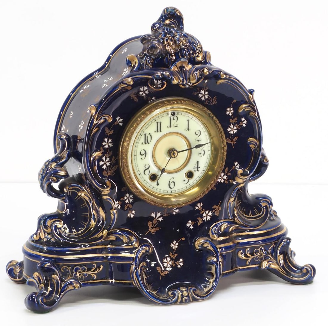 Waterbury Blue Porcelain & Hand Enameled Cased Shelf Clock: Waterbury Blue Porcelain & Hand Enameled Cased Shelf Clock Condition NOTICE! VERY IMPORTANT! Chupp Auctions is pleased to issue an opinion on any lot; the absence of a condition report does not in