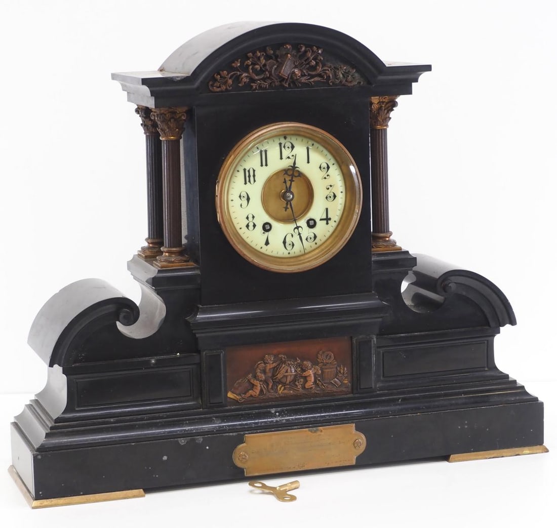Large Ansonia Mantle Clock with Black Slate Case: Large Black Slate Cased Ansonia Mantle Clock with Enamel Dial & Patinaed Bronze Embellishments of Winged Puttis, with key, brass works stamped A.1 and 4762 92 Condition NOTICE! VERY IMPORTANT! Chu