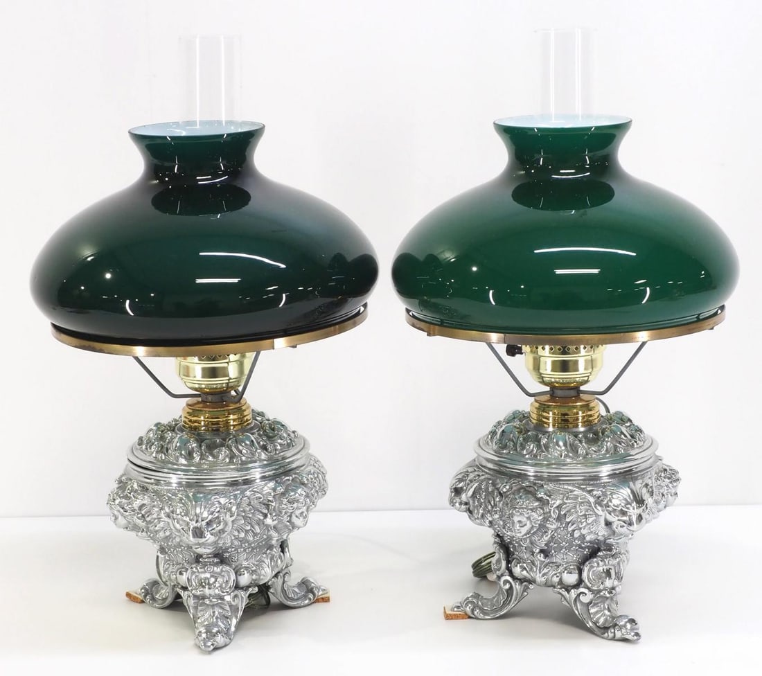 Matched Pair of Fancy Polished Nickel Student Lamps: Matched Pair of Fancy Polished Nickel Electrified Keroscene Student Lamps with Winged Griffins and Emerald Green Glass Shades Condition NOTICE! VERY IMPORTANT! Chupp Auctions is pleased to issue an op
