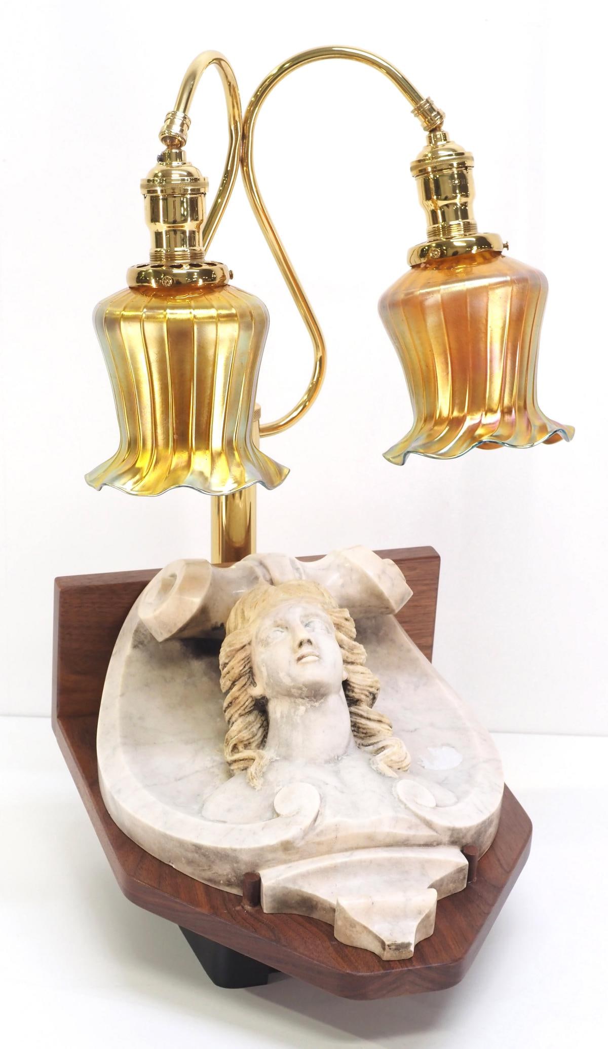 Brass Double Desk Lamp with Gold Aurene Glass Shades and Marble Bust: Presentation Piece of a Brass Double Desk Lamp with Gold Aurene Glass Shades Accenting a Sculpted Marble Female Bust Pediment Condition NOTICE! VERY IMPORTANT! Chupp Auctions is pleased to issue an op